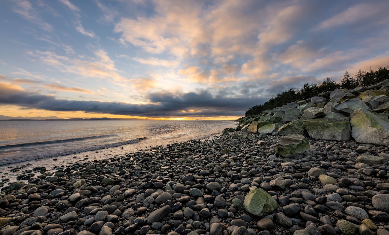 Free Photo of Rocky Shore During Sunset Stock Photo