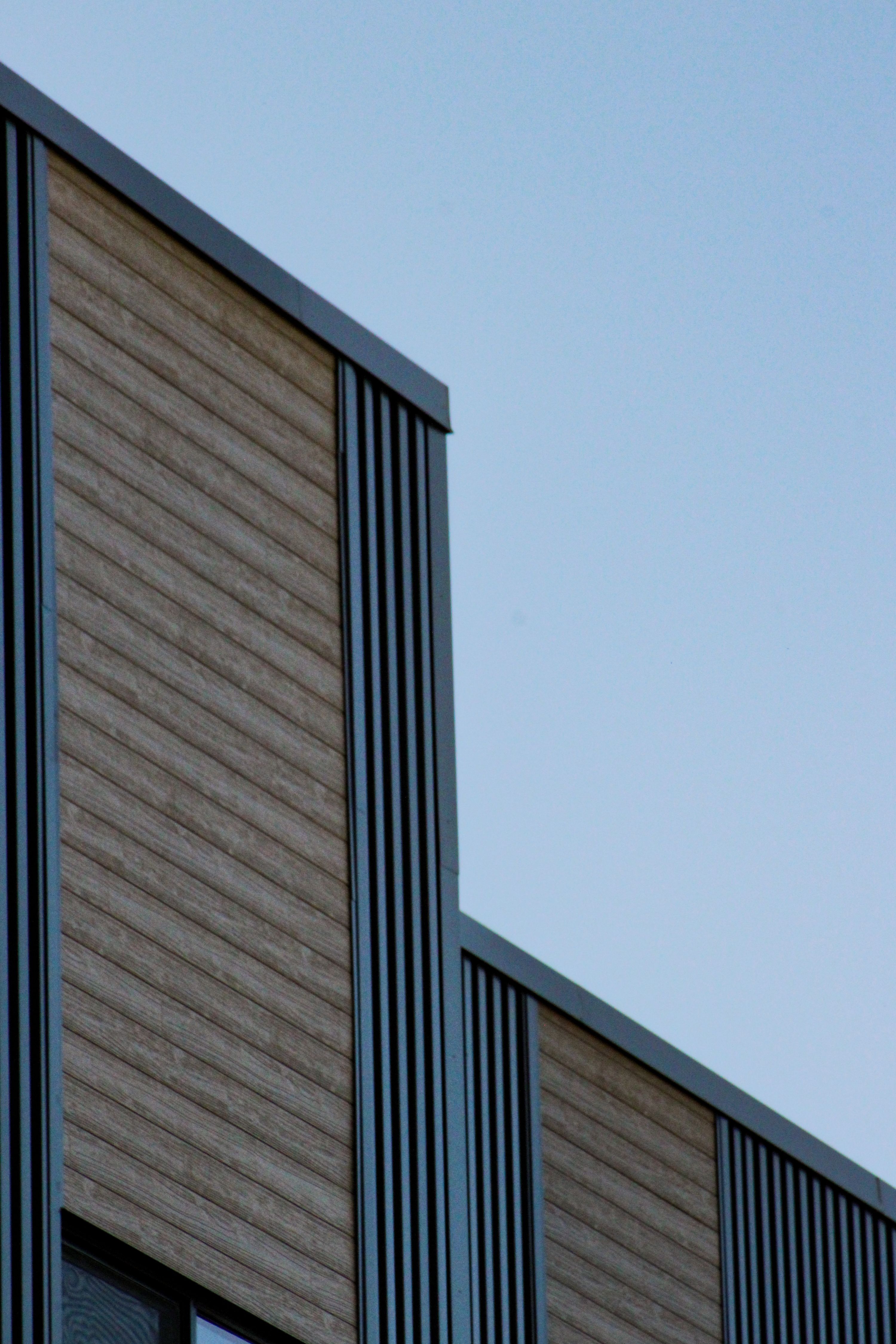 Modern building facade with vertical lines · Free Stock Photo