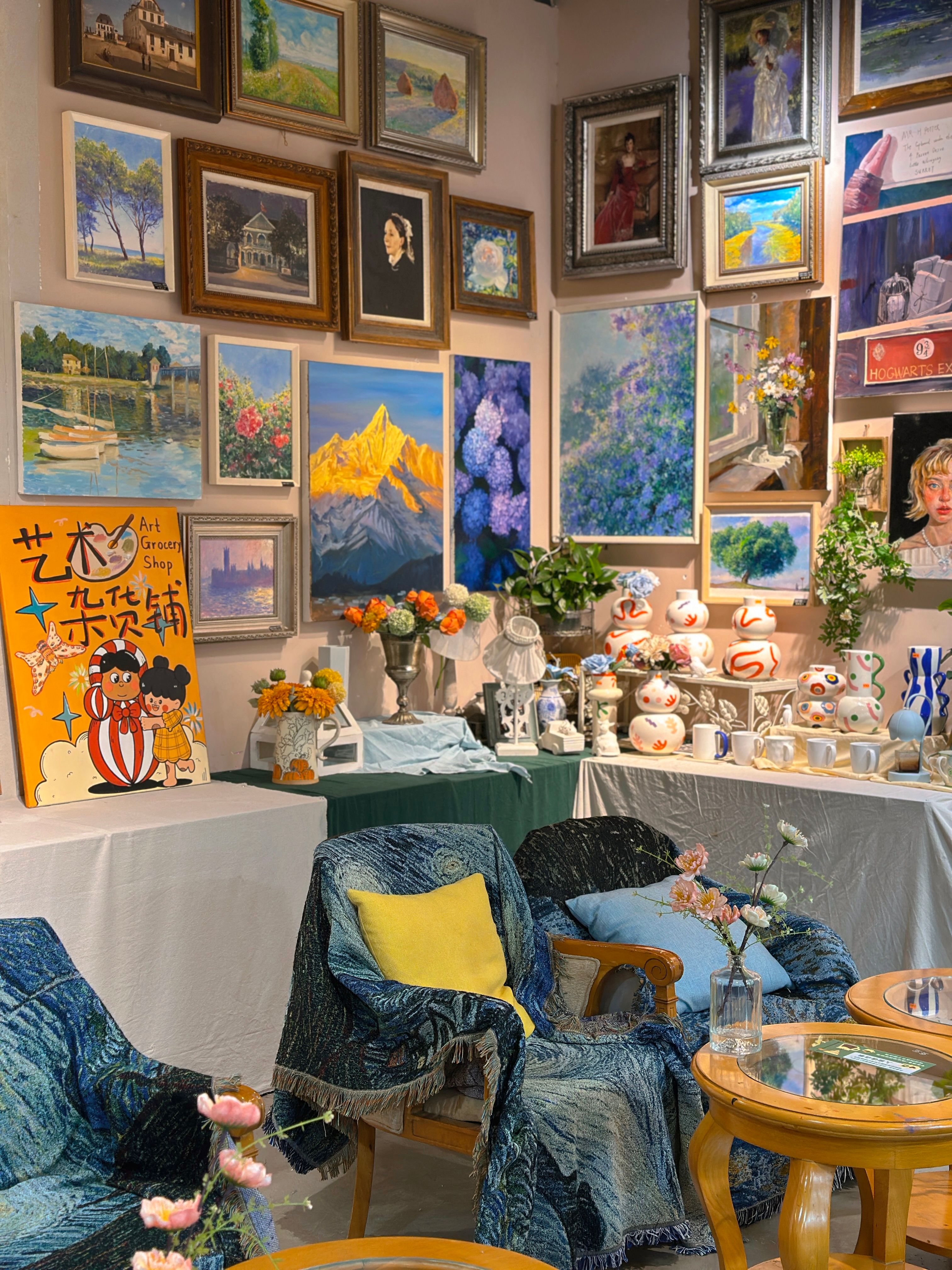 A vibrant art gallery with paintings, pottery, and cozy seating for an artistic ambiance.