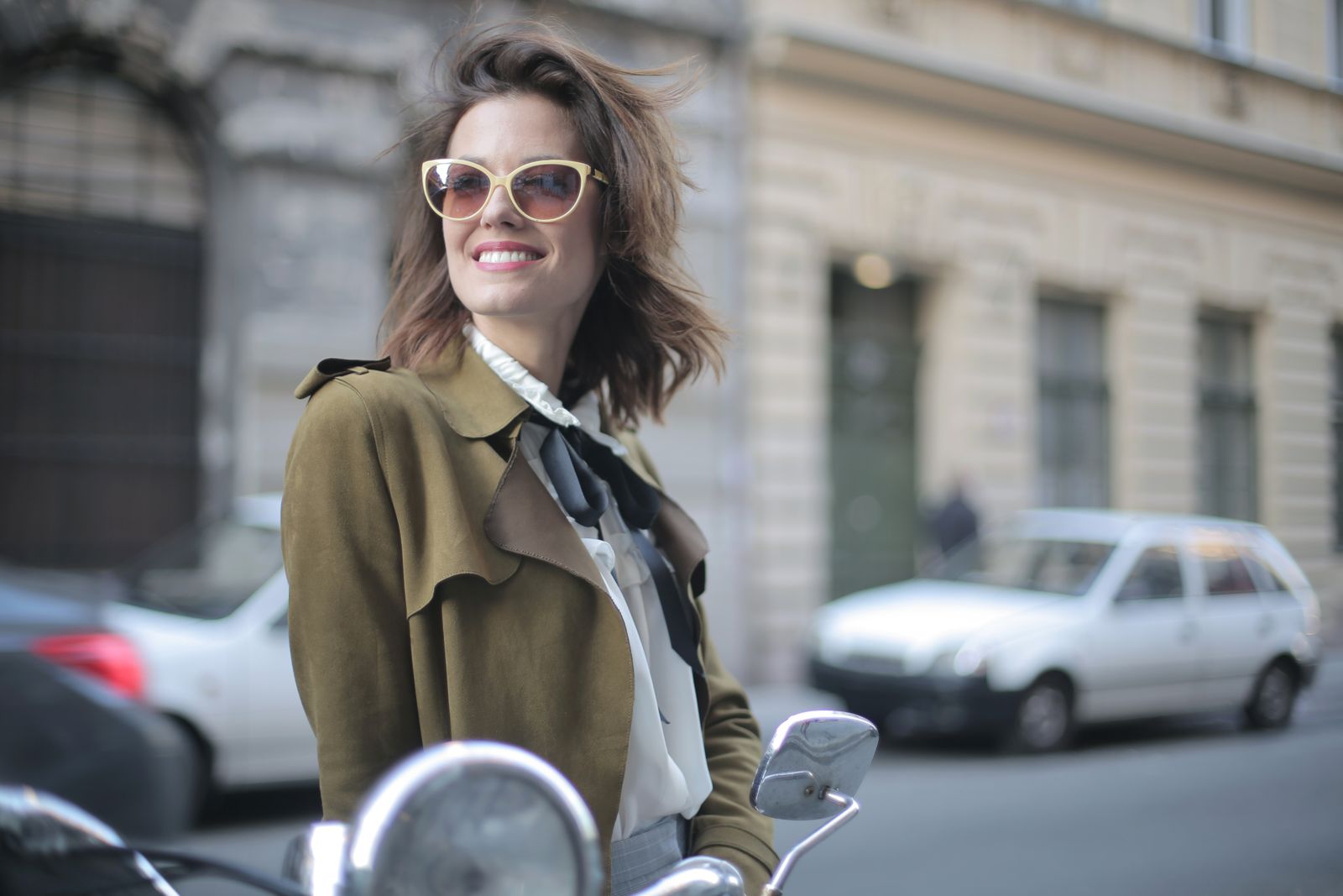 A stylish confident woman on a city street — the art of French-girl beauty