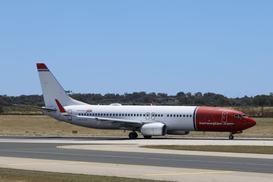 Norwegian Air Shuttle aircraft at Oslo Gardermoen Airport, ready for a domestic flight