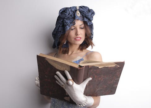 Woman in Purple Spaghetti Strap Reading an Old Book