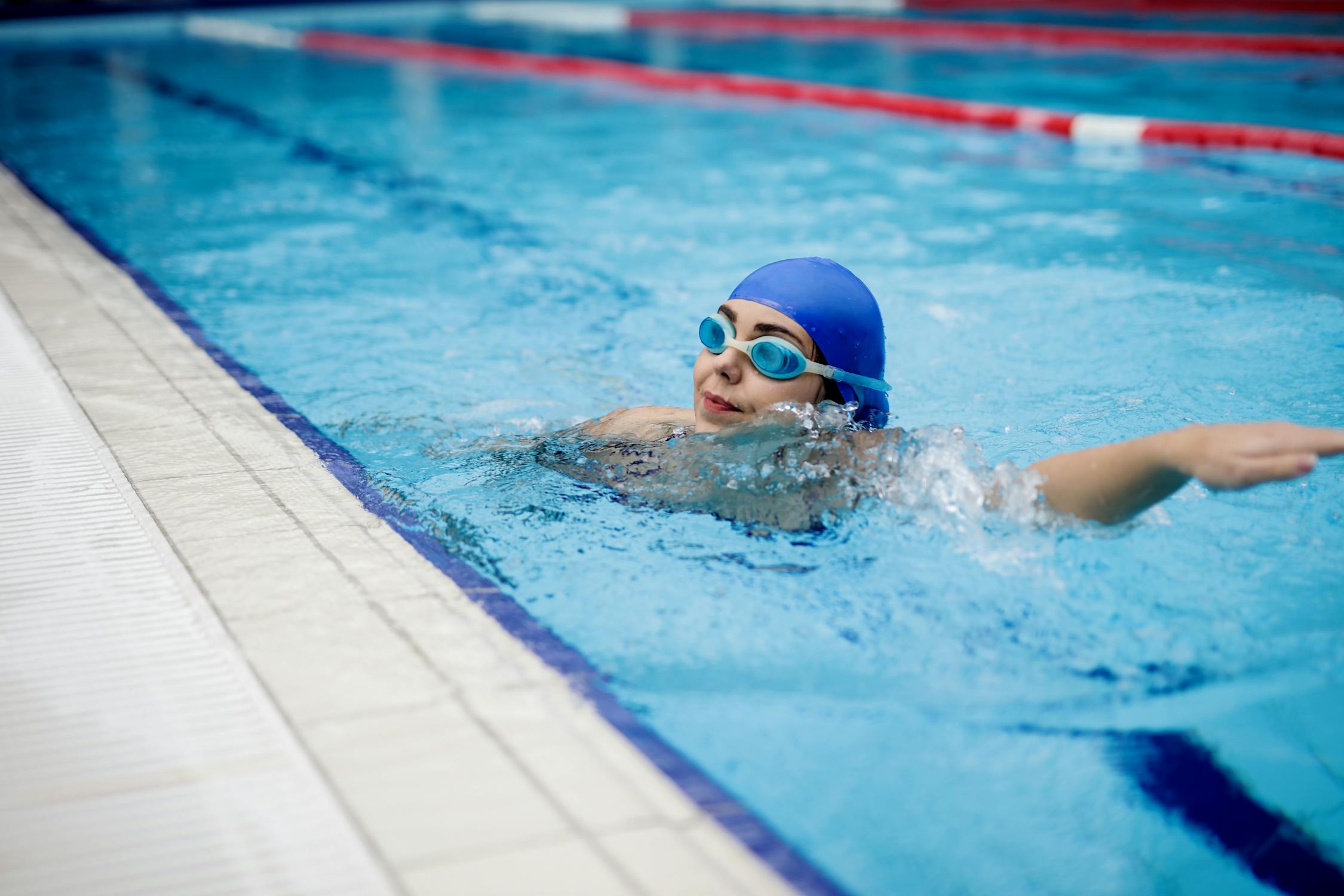 Person In Swimming Goggles In Swimming Pool · Free Stock Photo