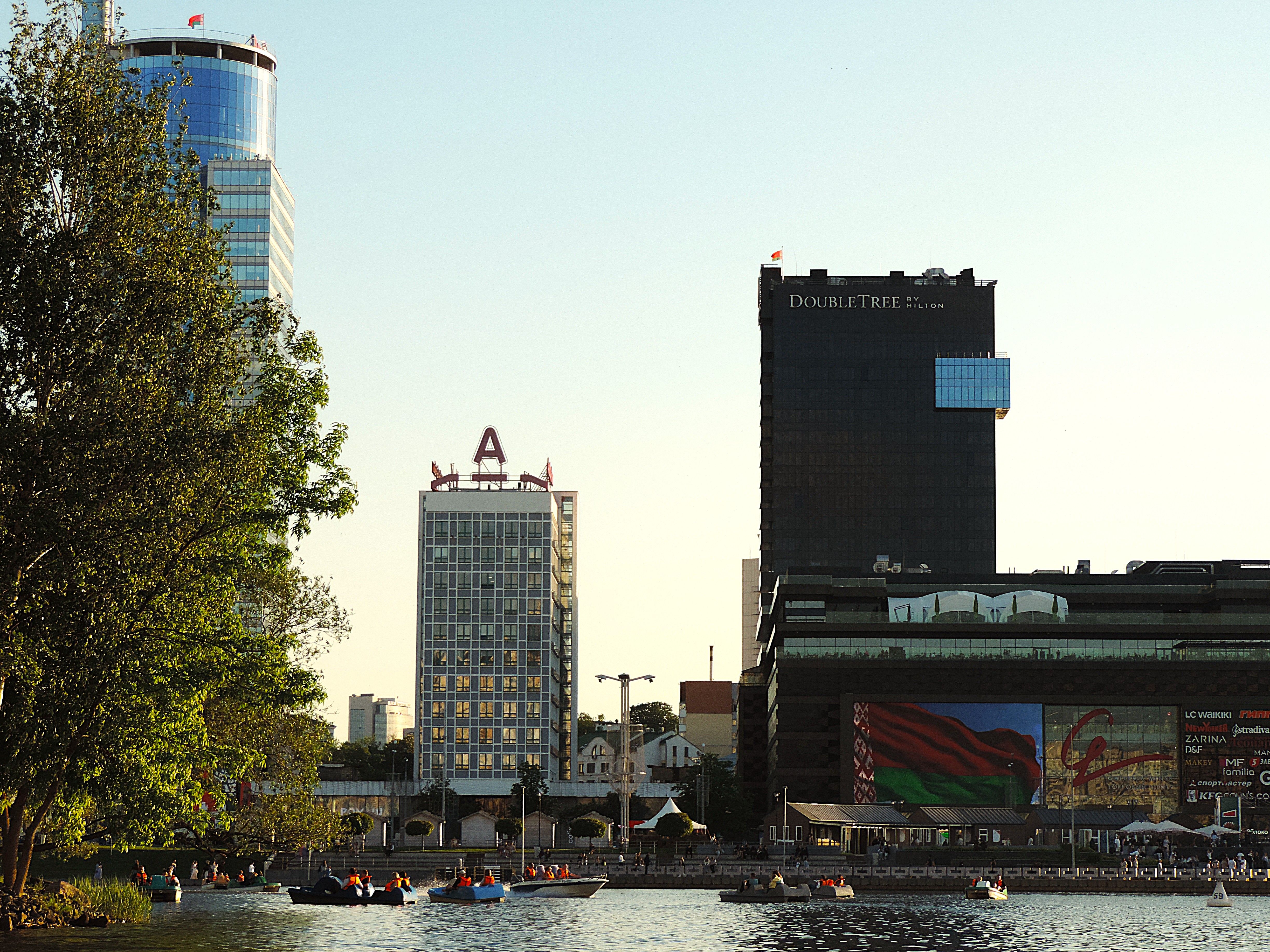 Modern Cityscape with Skyscrapers and Boats