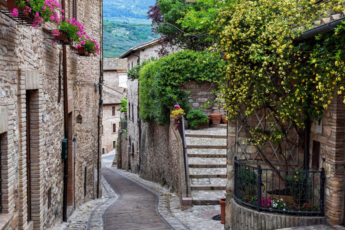 Spello's flower-draped lane — a Roman and medieval village famous for its Corpus Christi flower carpets.