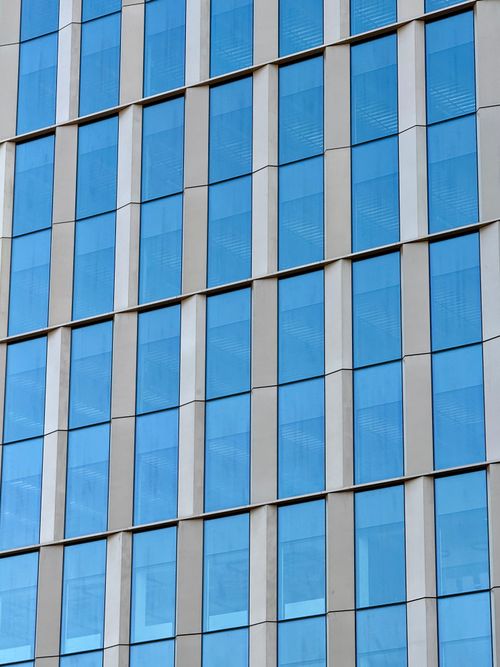 Free Detailed view of a modern glass building facade with blue windows in Boston, USA. Stock Photo