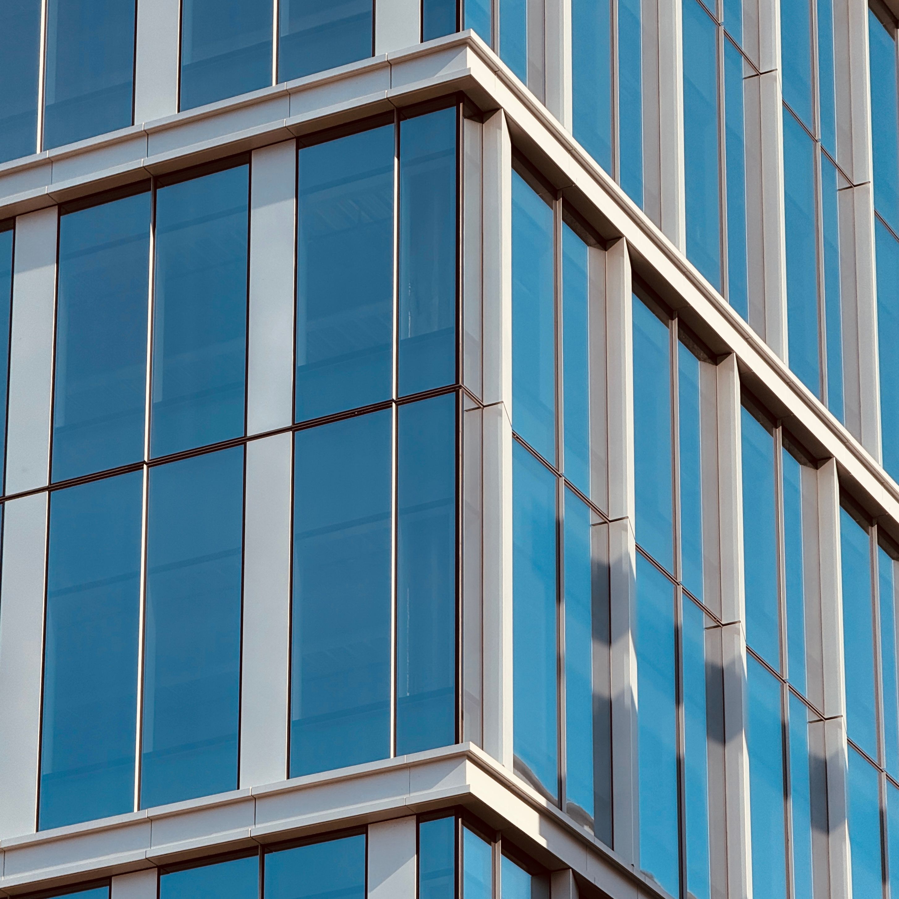 Close-up of a modern building with glass facade in Boston, showcasing architectural design.