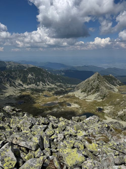 Free Breathtaking panoramic view of Retezat Mountains under a dramatic sky with lush greenery. Stock Photo