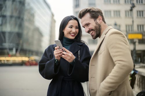 Free Couple Standing Near Buildings Stock Photo