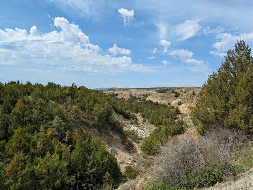 Free Explore the stunning natural beauty of the rugged badlands landscape in North Dakota under a vivid blue sky. Stock Photo