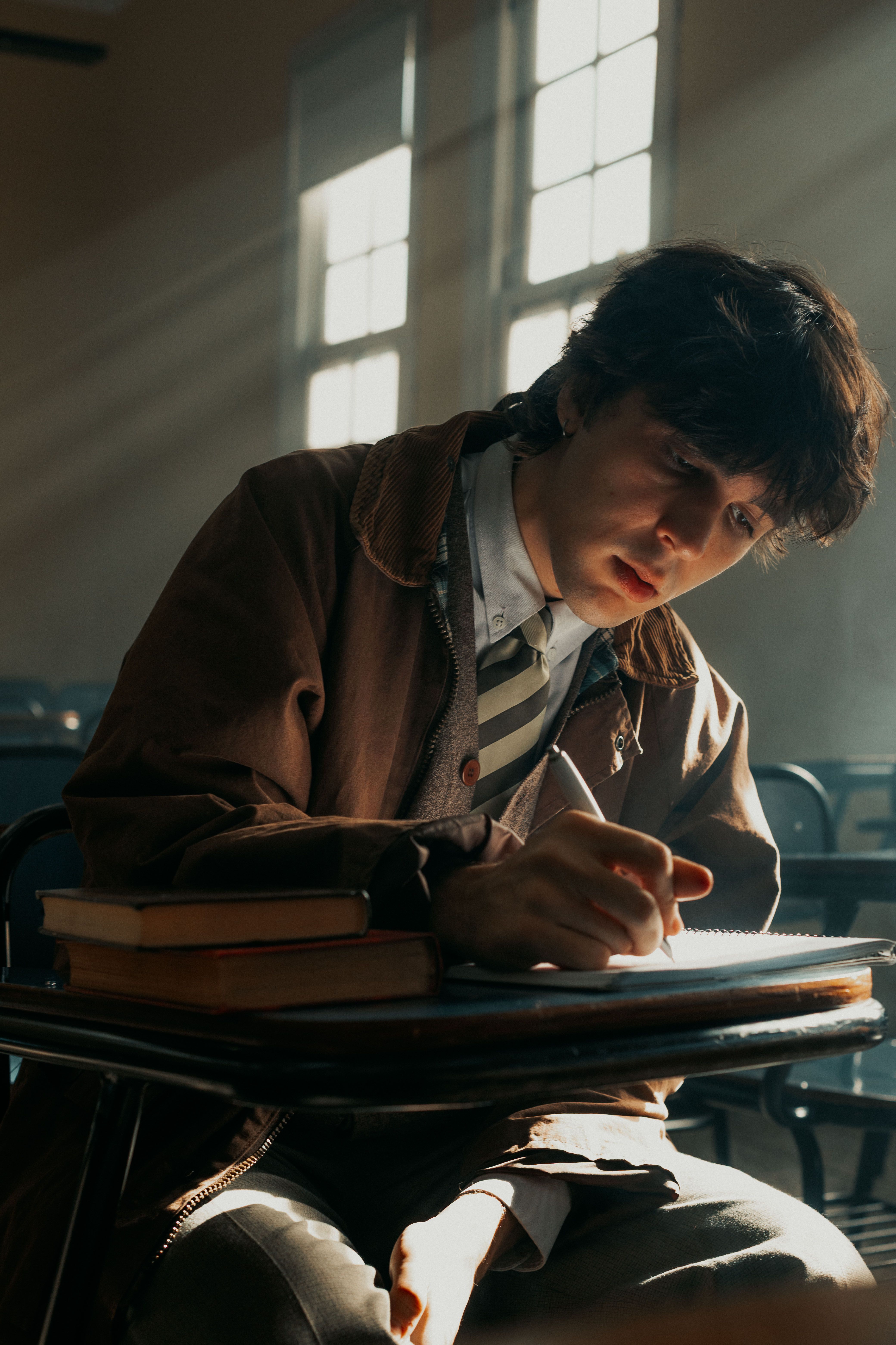 Focused Student Studying in Classroom · Free Stock Photo