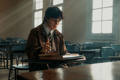 Free A thoughtful student studies in a sunlit classroom in Buenos Aires, capturing a moment of concentration. Stock Photo