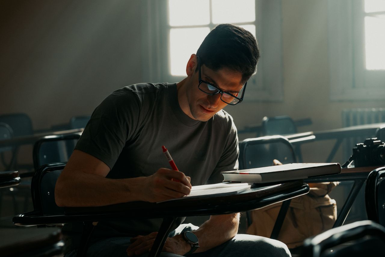 young man studying in a sunlit university classroom in buenos aires ar