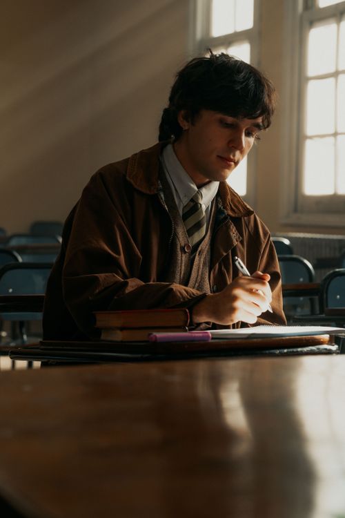 Free A young male student focusing on his notes in a university classroom in Buenos Aires, Argentina. Stock Photo