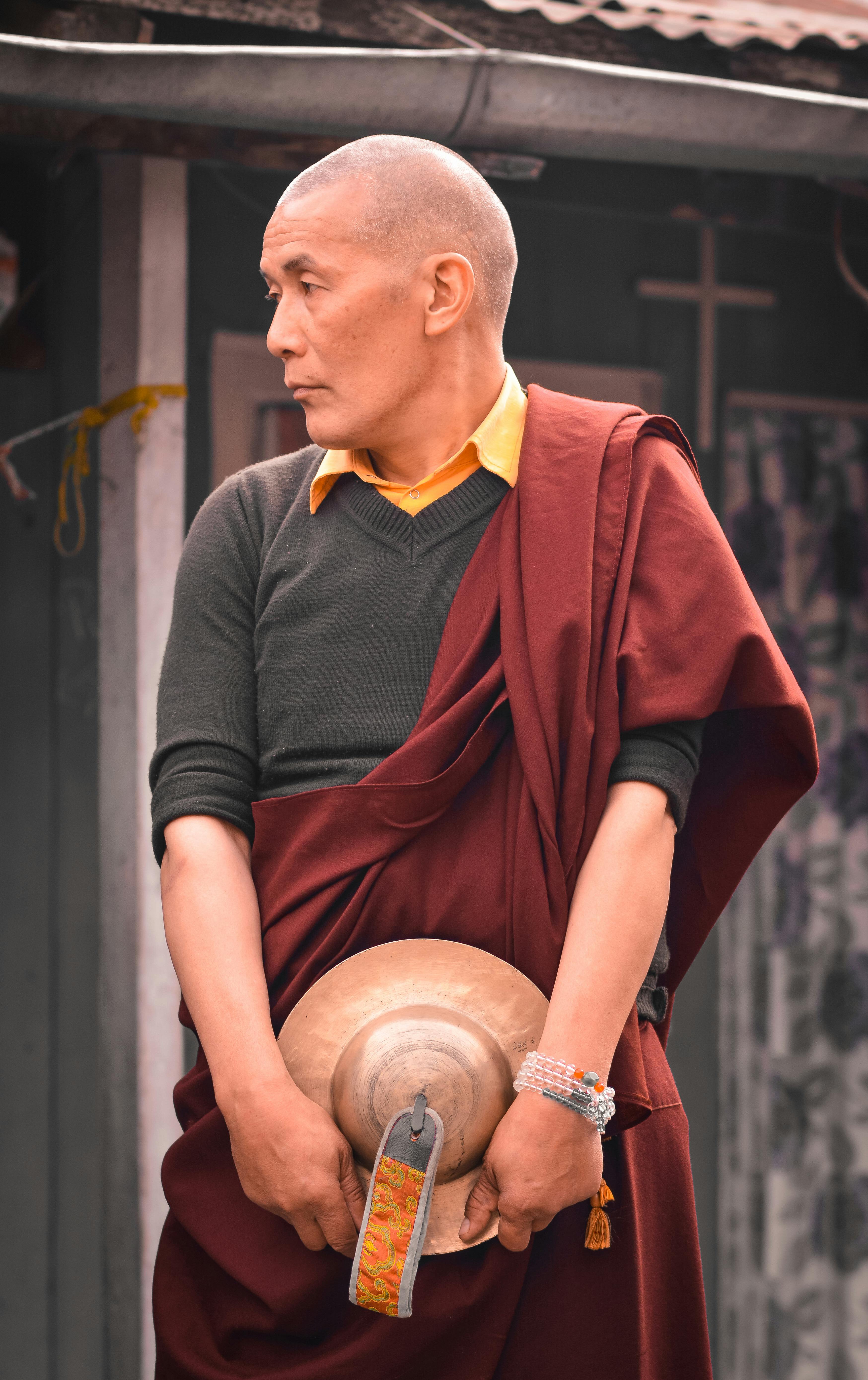 Buddhist Asian monk in traditional clothes on street · Free Stock Photo