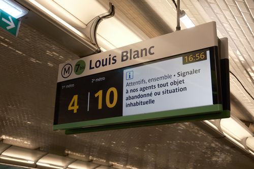 Free Close-up of Louis Blanc Metro sign in Paris subway station with route information. Stock Photo