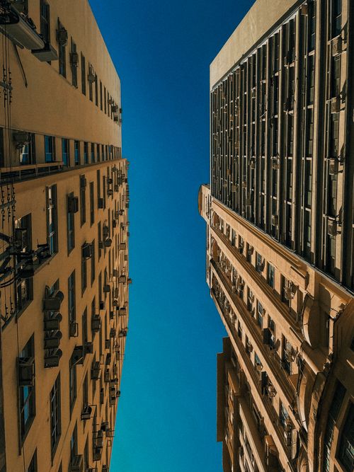 Free Wide-angle shot of tall buildings against a bright sky in Rio de Janeiro. Stock Photo
