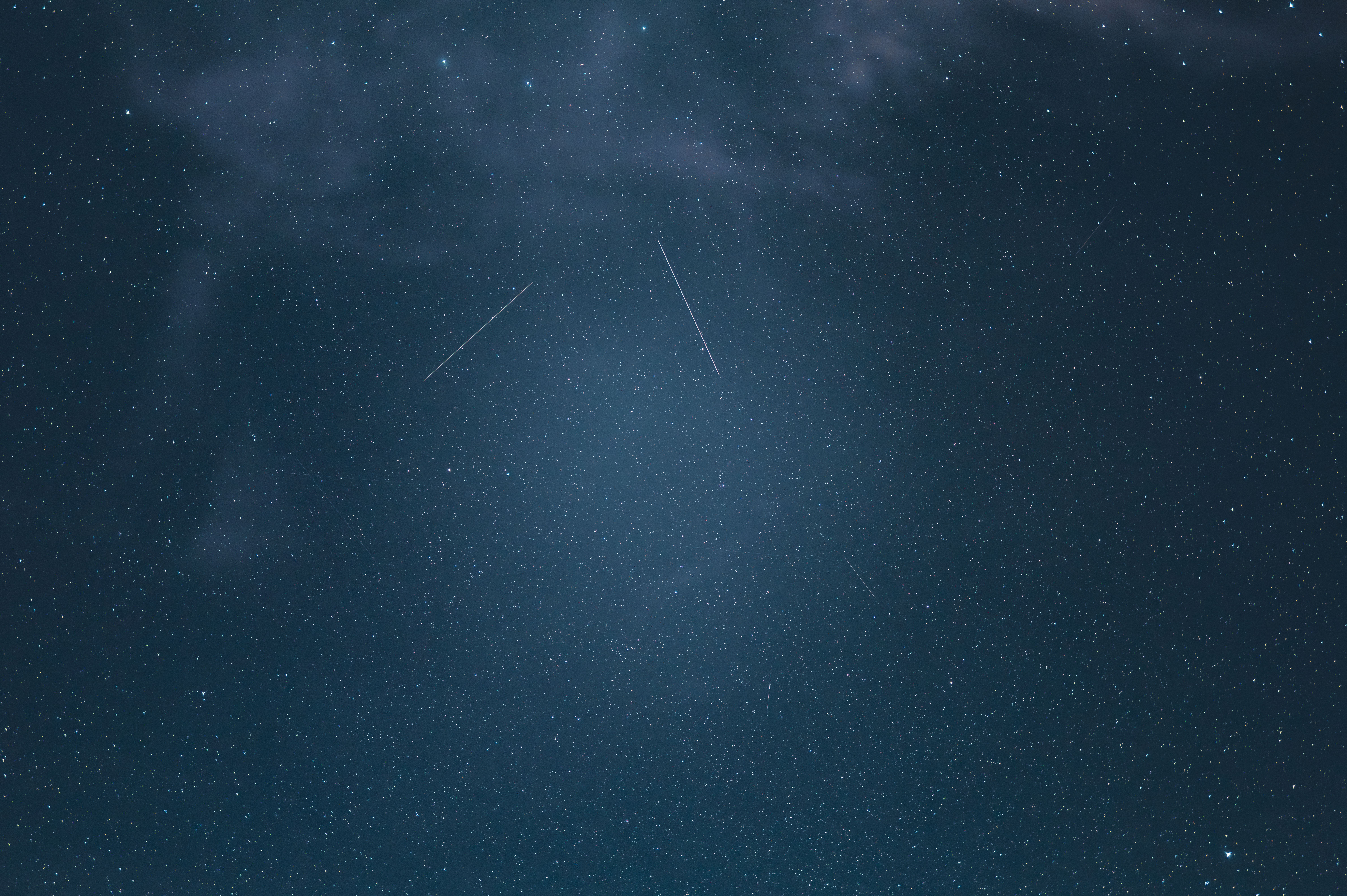 A mesmerizing view of the star-filled sky with shooting stars captured at night in Saint-Georges-de-Didonne, France.