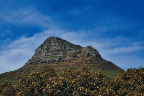 Free Capture the majestic beauty of Lion's Head, a famous landmark in Cape Town, South Africa, under a clear blue sky. Stock Photo
