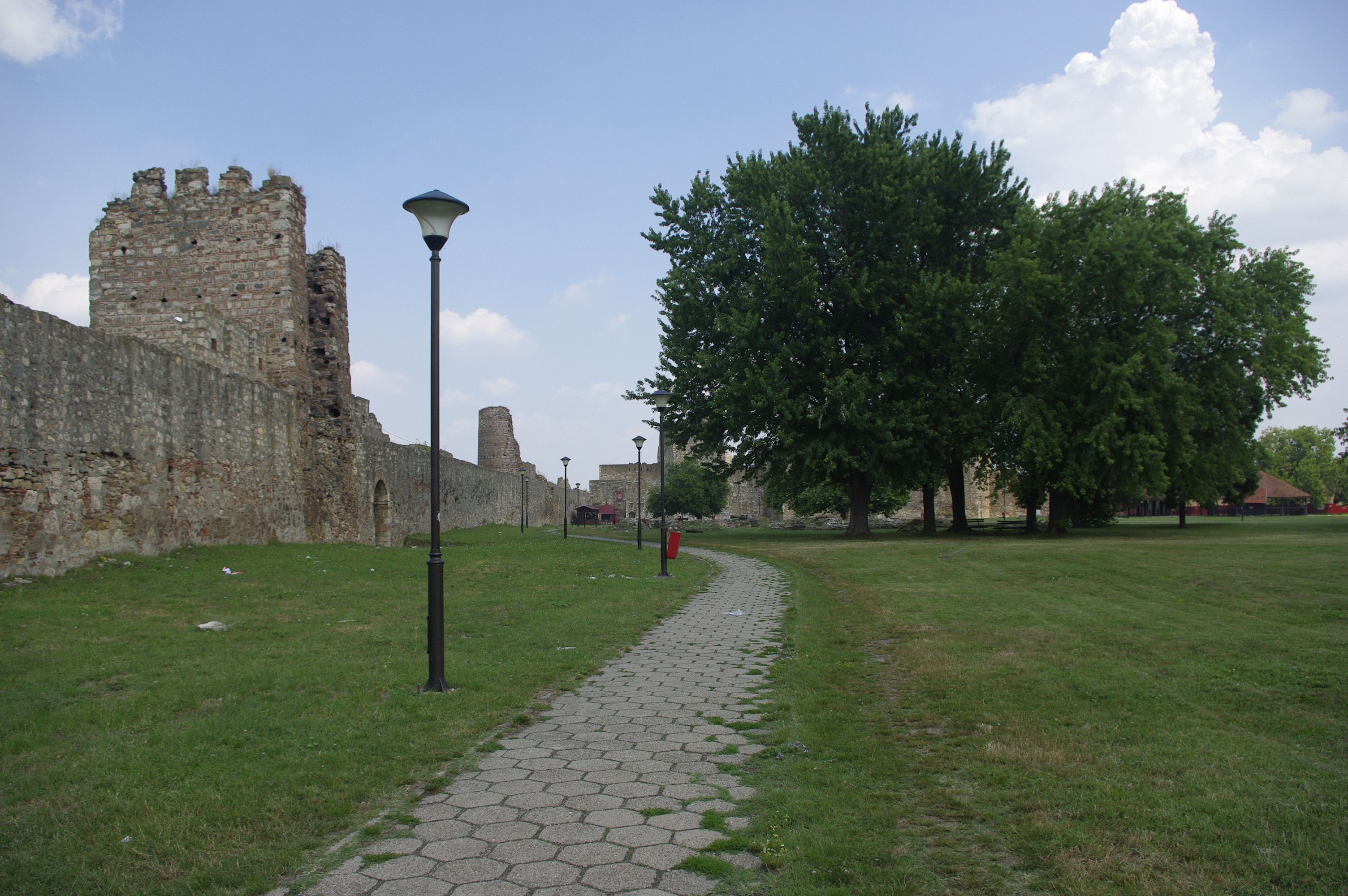 Tourists exploring the ancient grounds of Kalemegdan Fortress in Belgrade, Serbia