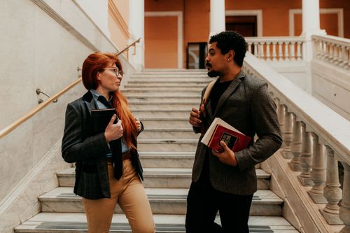 Free Two university students discussing on a staircase in Buenos Aires. Stock Photo