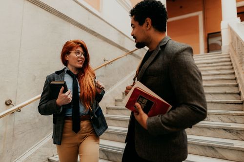 Free Two university students conversing on a staircase in Buenos Aires, Argentina. Stock Photo