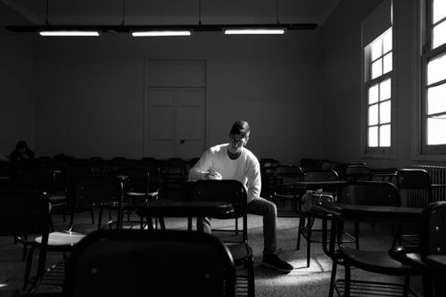 Free A solitary student studying in an empty classroom in Buenos Aires, Argentina. Stock Photo