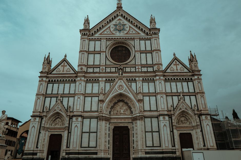 Dramatic view of the Basilica di Santa Croce facade, Florence, capturing gothic architecture.