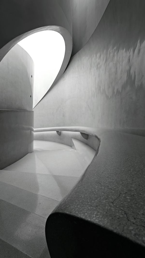 Curved minimalist staircase, by Devansh Rajput on Pexels