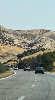 A picturesque road trip through the hilly landscapes near Azrou, Fès-Meknès, capturing natural beauty.