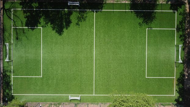 Top-down view of a soccer field with clear boundaries in Piaseczno, Poland.