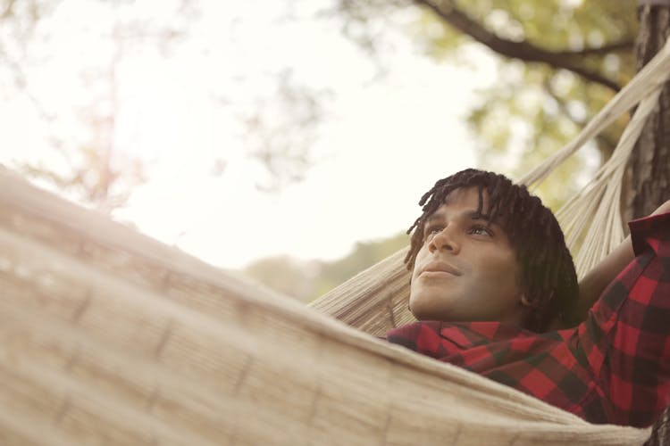 Man Lying On Hammock