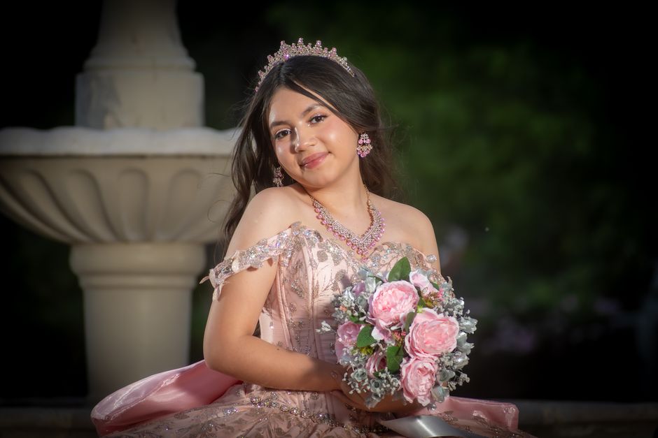 Beautiful teenage girl in a quinceañera dress outdoors, representing San Antonio quinceañera celebrations and event rentals