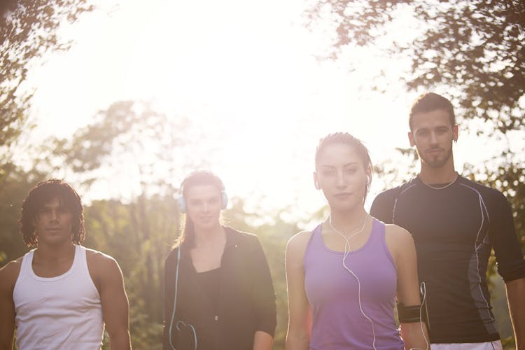 Group Of People Walking Near Trees