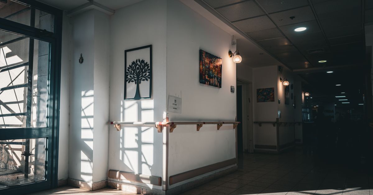 A quiet healthcare corridor, shown as an illustrative stock photo.