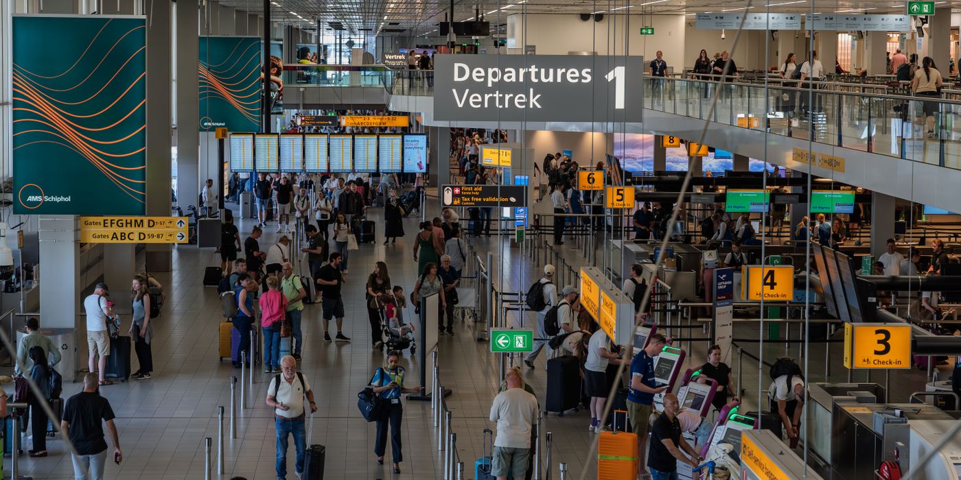Busy departure hall at a European airport under the new EES and ETIAS entry rules