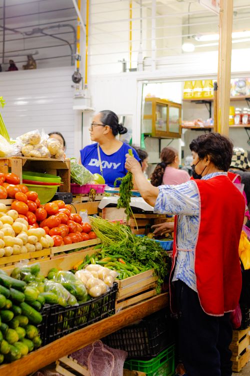 Free A bustling local market in Tepic, Nayarit with fresh produce and interacting shoppers. Stock Photo
