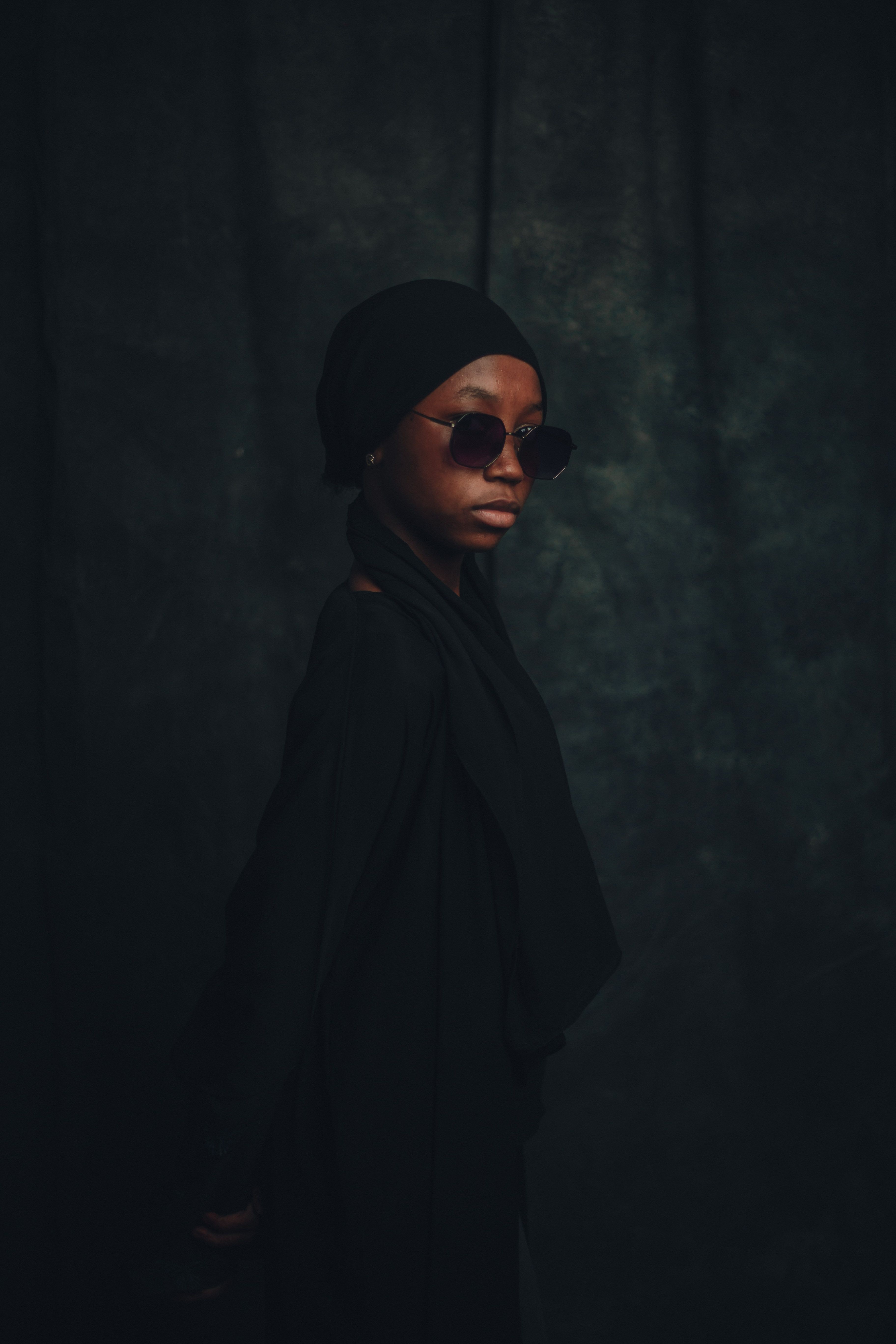 Elegant portrait of a young woman in traditional Nigerian attire, showcasing cultural fashion.