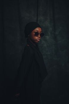 Elegant portrait of a young woman in traditional Nigerian attire, showcasing cultural fashion.