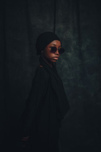 Elegant portrait of a young woman in traditional Nigerian attire, showcasing cultural fashion.