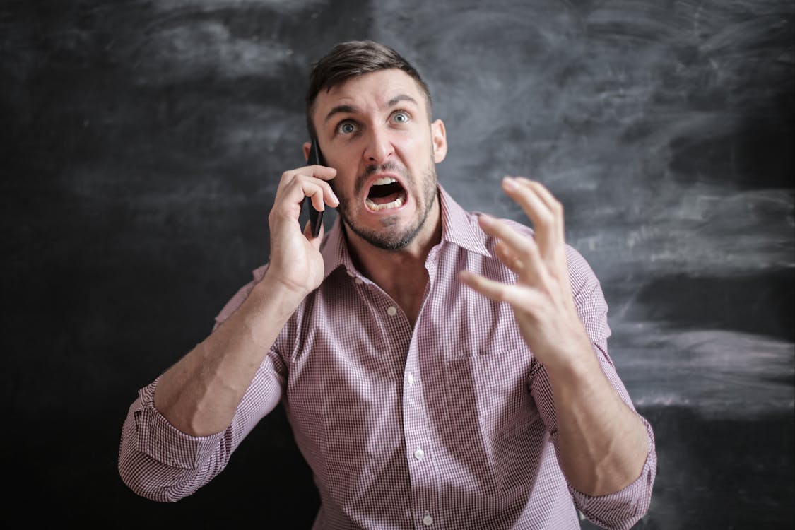 https://www.pexels.com/photo/man-in-pink-dress-shirt-3777568/