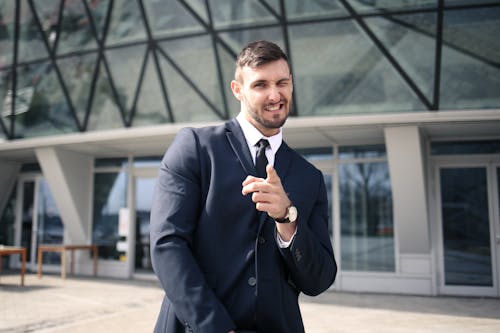 Free Man in Black Suit Jacket While Winking Stock Photo