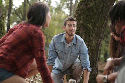 Free Happy friends spending time in forest Stock Photo