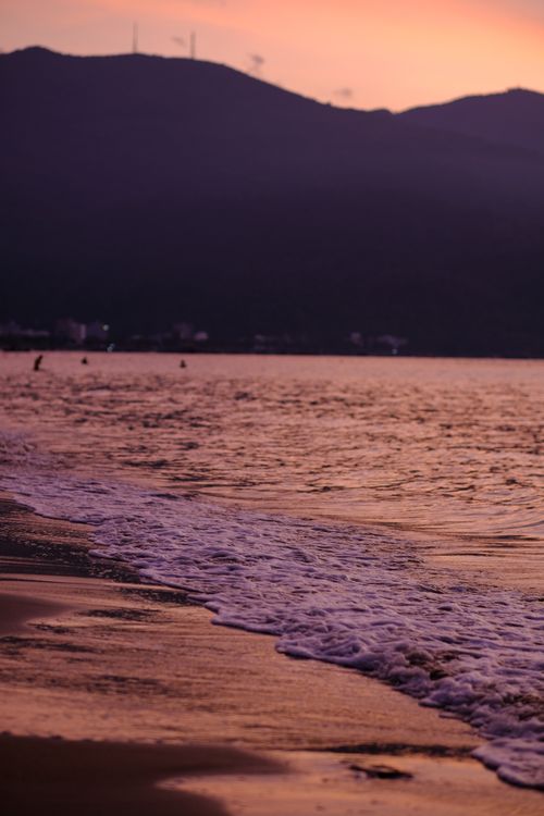 Free Experience tranquility with a serene sunset at Da Nang's scenic beach, Vietnam. Stock Photo