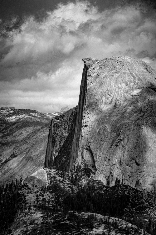 Free A striking black and white image of Half Dome with a cloudy sky in Yosemite National Park. Stock Photo