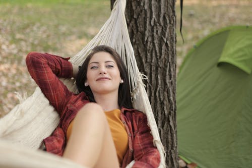 Free Shallow Focus Photo of Woman Lying on Hammock Stock Photo