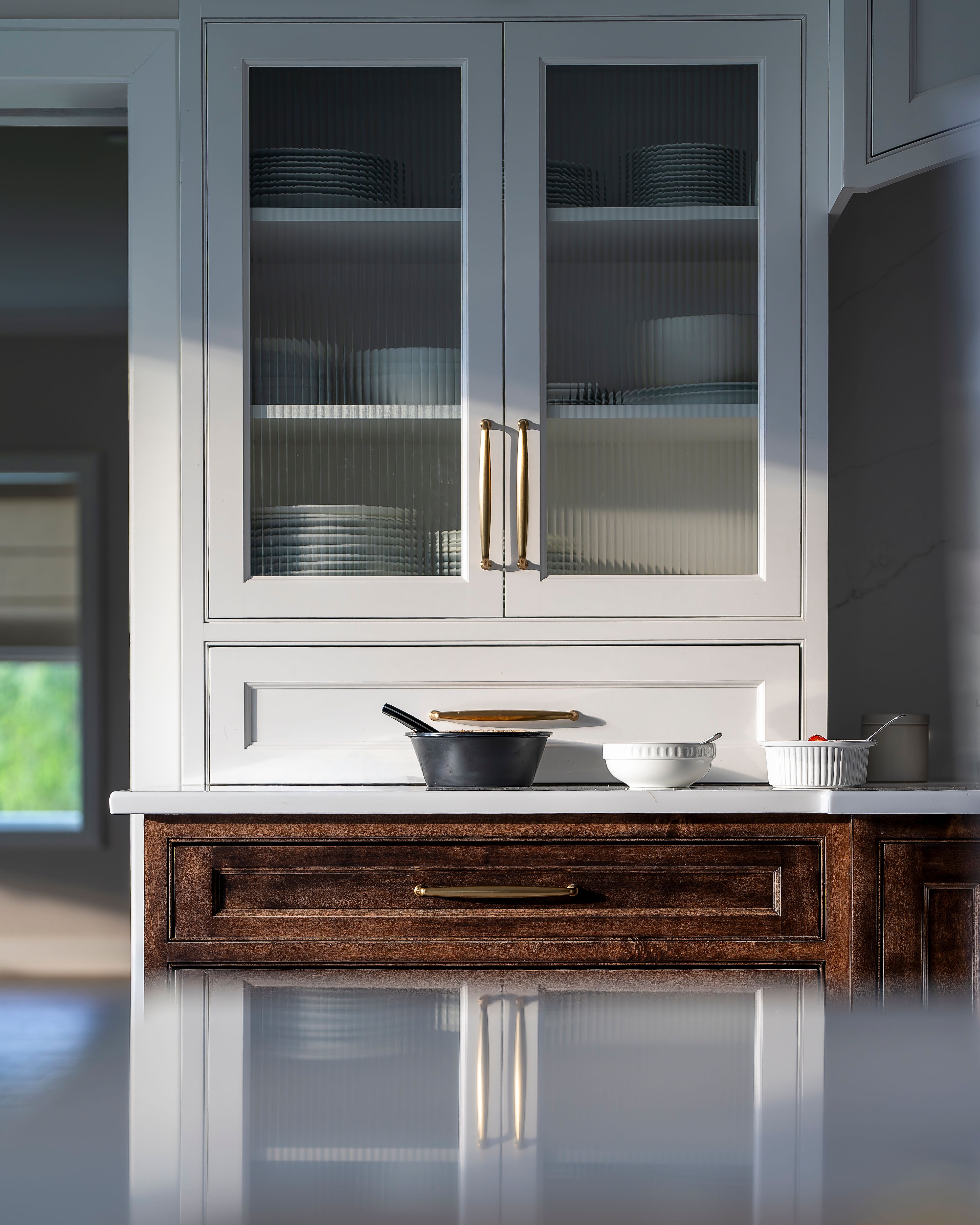 A stylish modern kitchen featuring white cabinets, cookware, and wooden accents. Perfect for home decor inspiration.