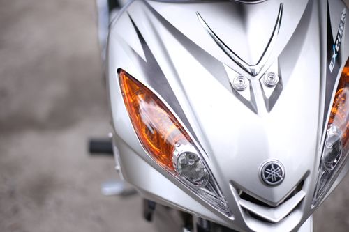 Free Detailed view of a sport motorcycle front, showcasing headlights and sleek contours. Stock Photo