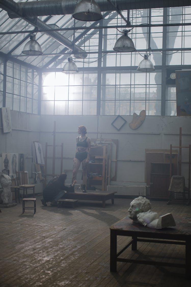 Woman Standing Inside A Building 