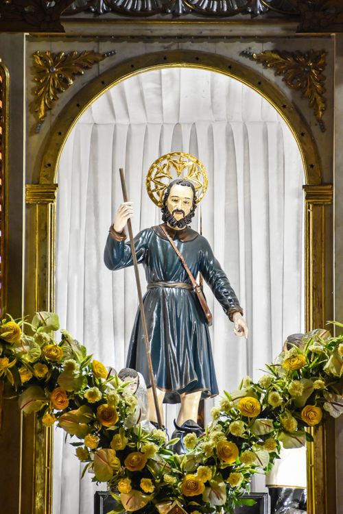 Free Beautiful depiction of San Isidro Labrador inside church in Pulilan, Central Luzon, decorated with yellow and white flowers. Stock Photo